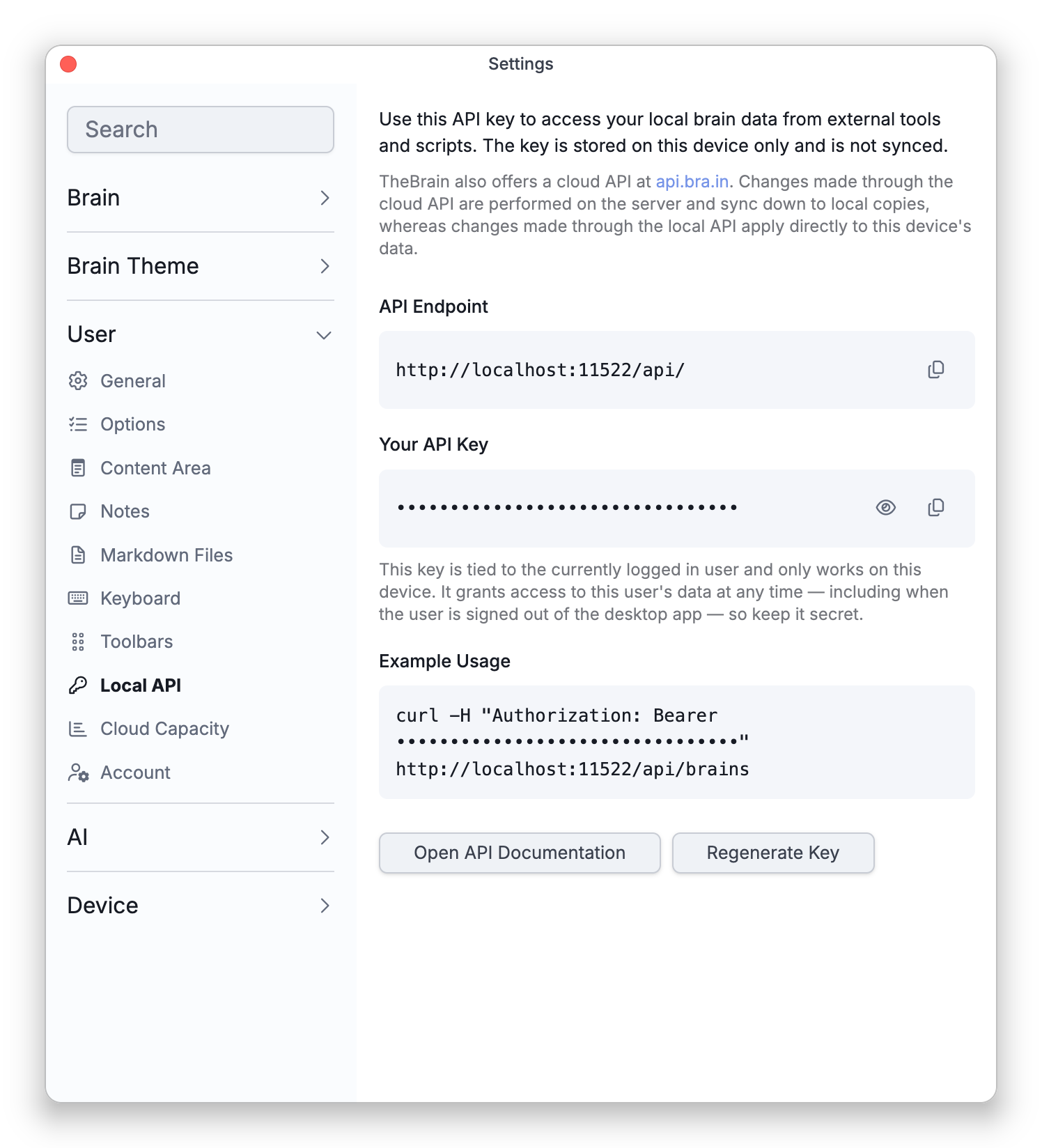 The Local API tab in Settings, with the API endpoint, the key shown as dots, an example and the Regenerate Key button