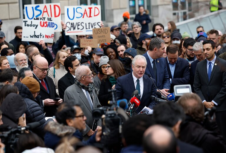 WASHINGTON, DC - FEBRUARY 03: U.S. Sen. Chris Van Hollen (D., Md.) and Rep. Gerry Connolly (R., Va.), joined by fellow lawmakers and employees and supporters of U.S. Agency for International Development (USAID) speak at a press conference outside of USAID headquarters on February 03, 2025 in Washington, DC. Elon Musk, tech billionaire and head of the Department of Government Efficiency (DOGE), said in a social media post that he and U.S. President Donald Trump will shut down the foreign assistance agency.