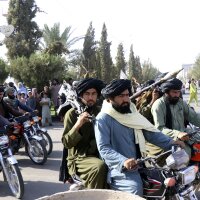 Taliban fighters celebrate the third anniversary of the withdrawal of US-led troops from Afghanistan on Aug. 14, 2024.
